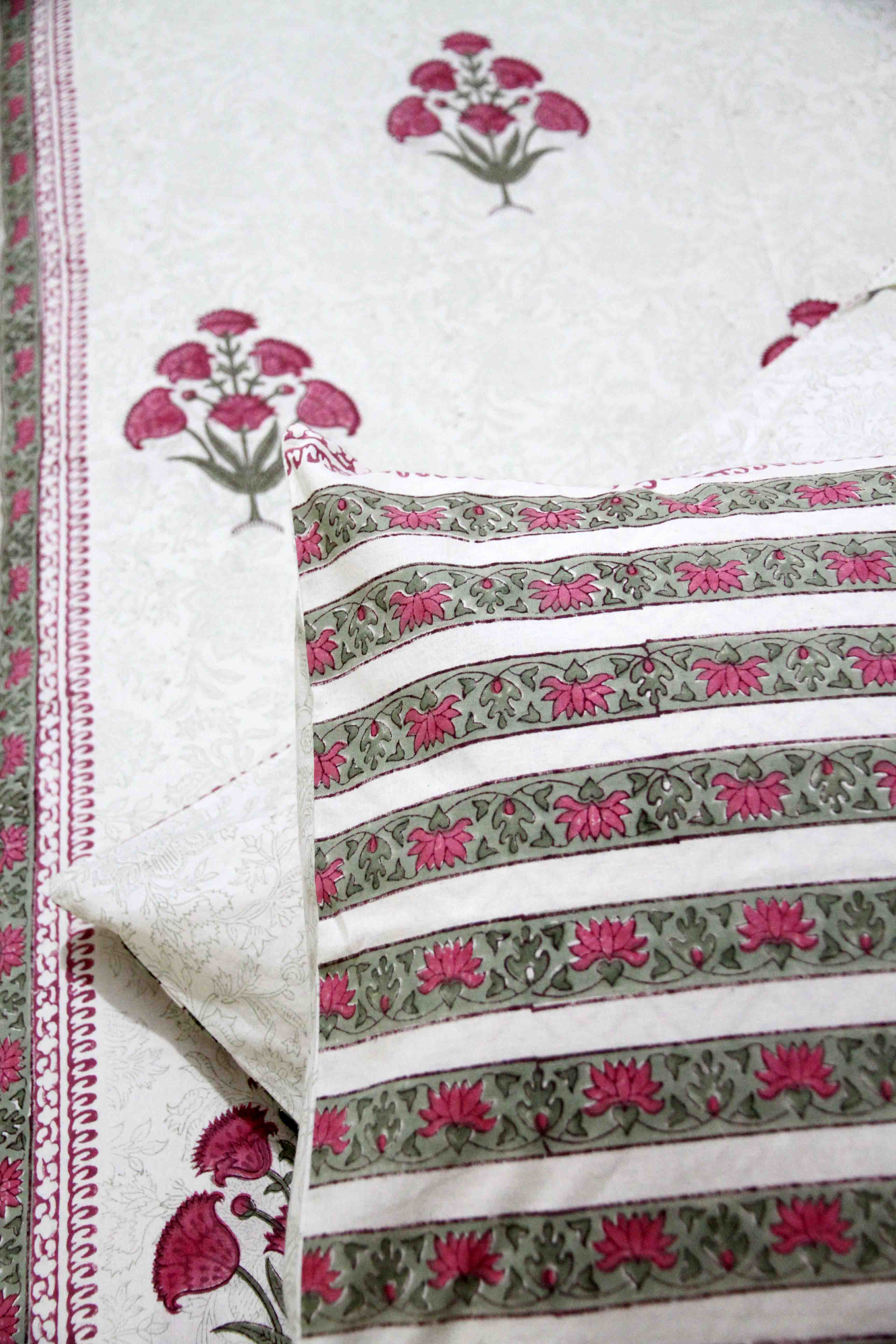 White and pink block printed cotton bedsheet with pillow covers