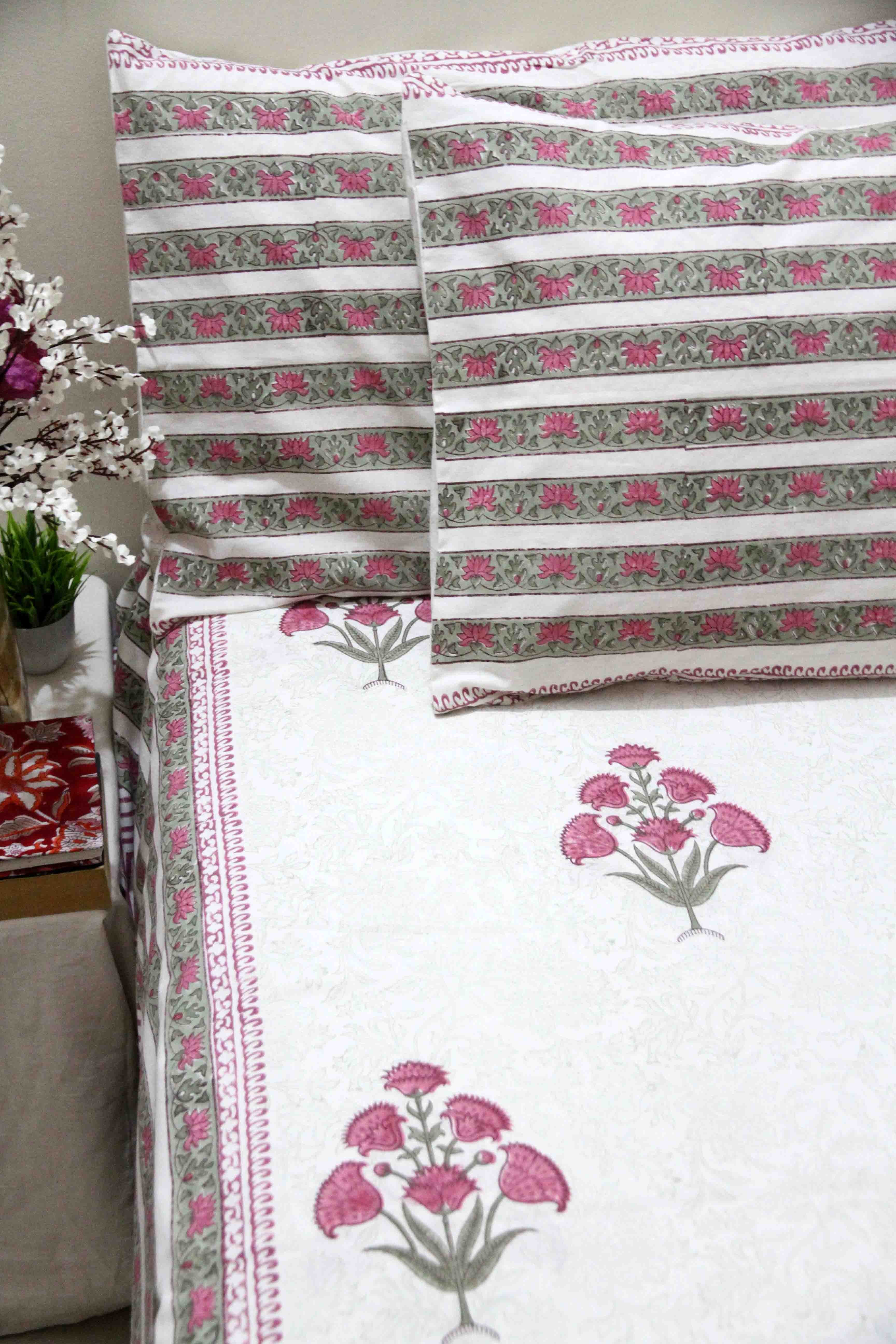 White and pink block printed cotton bedsheet with pillow covers