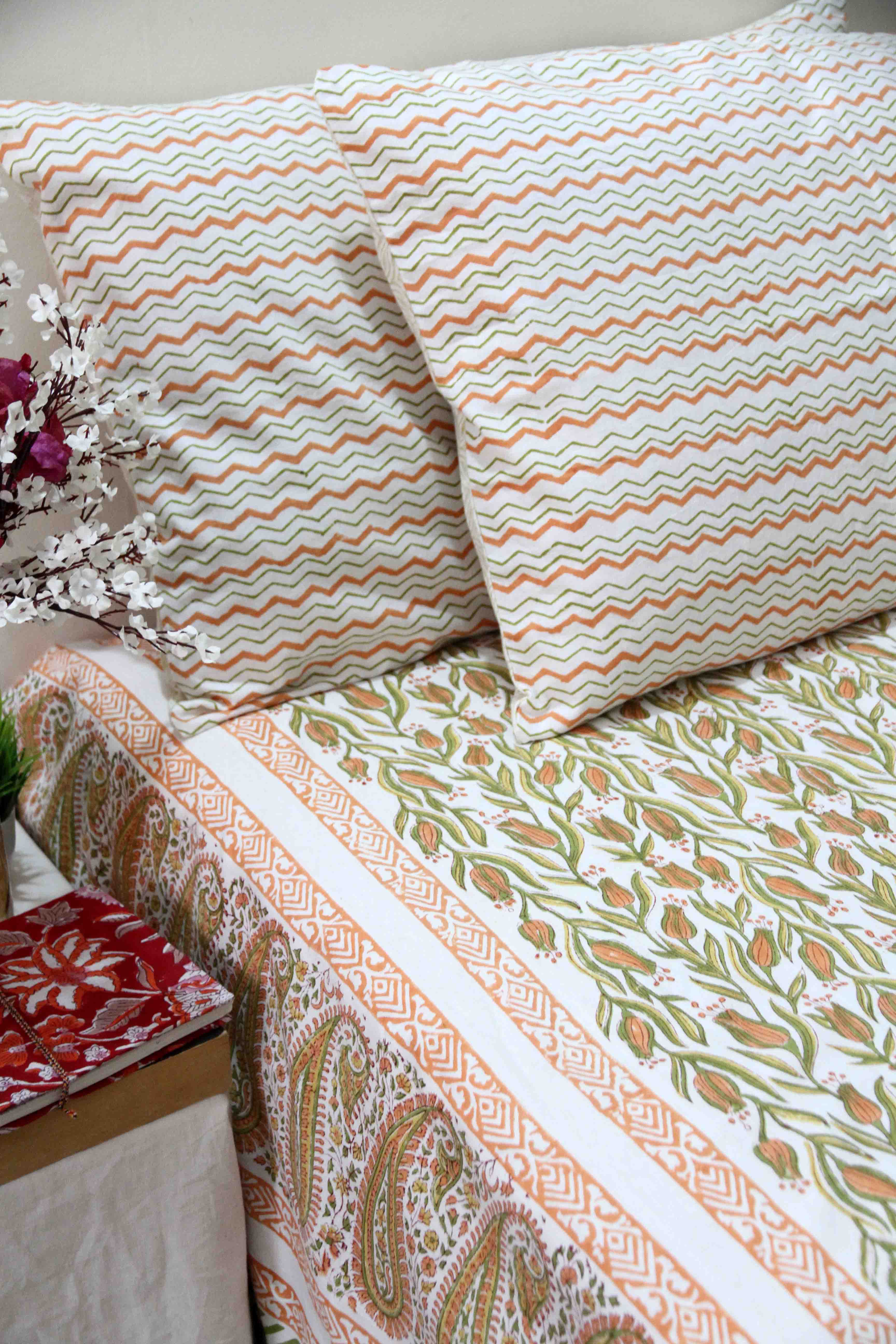 orange and green floral block printed cotton bedsheet with pillow covers