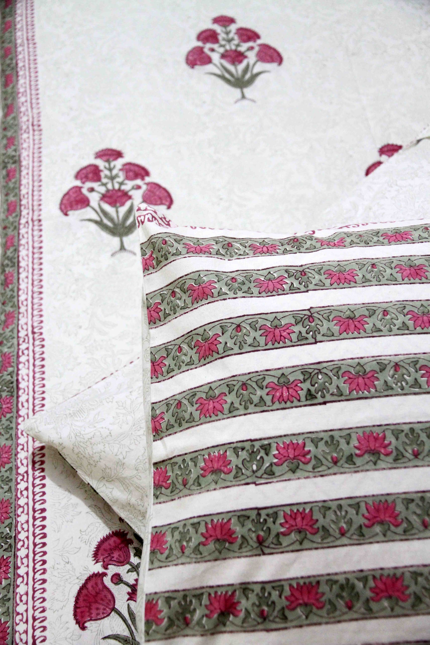 White and pink block printed cotton bedsheet with pillow covers