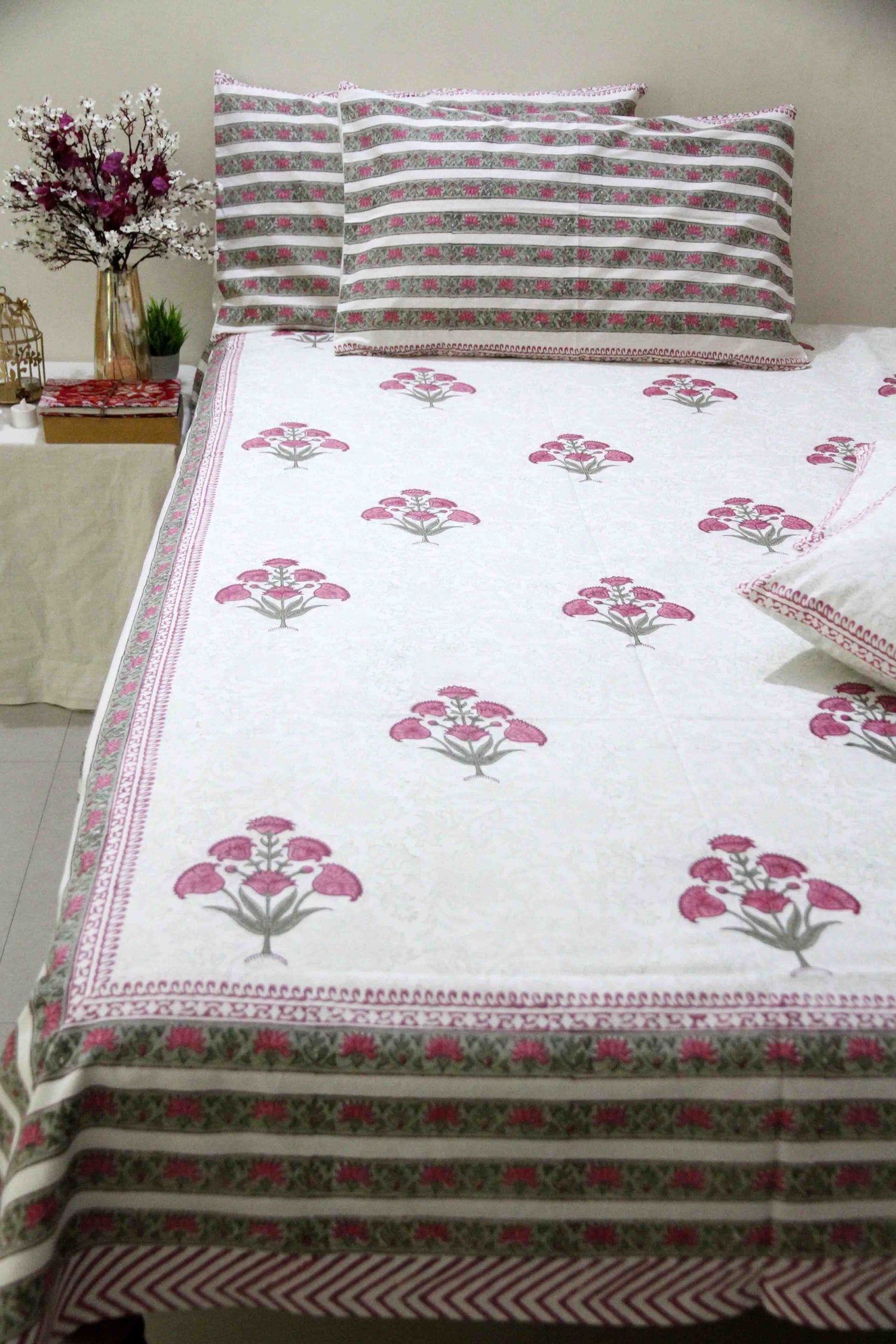 White and pink block printed cotton bedsheet with pillow covers