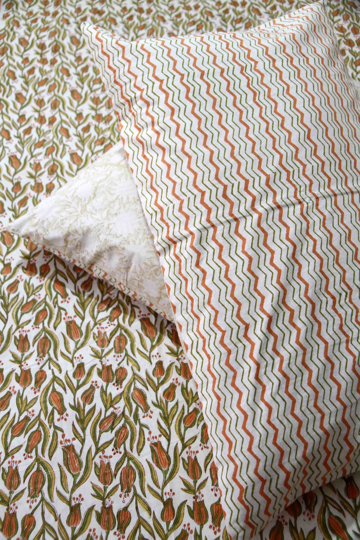 orange and green floral block printed cotton bedsheet with pillow covers