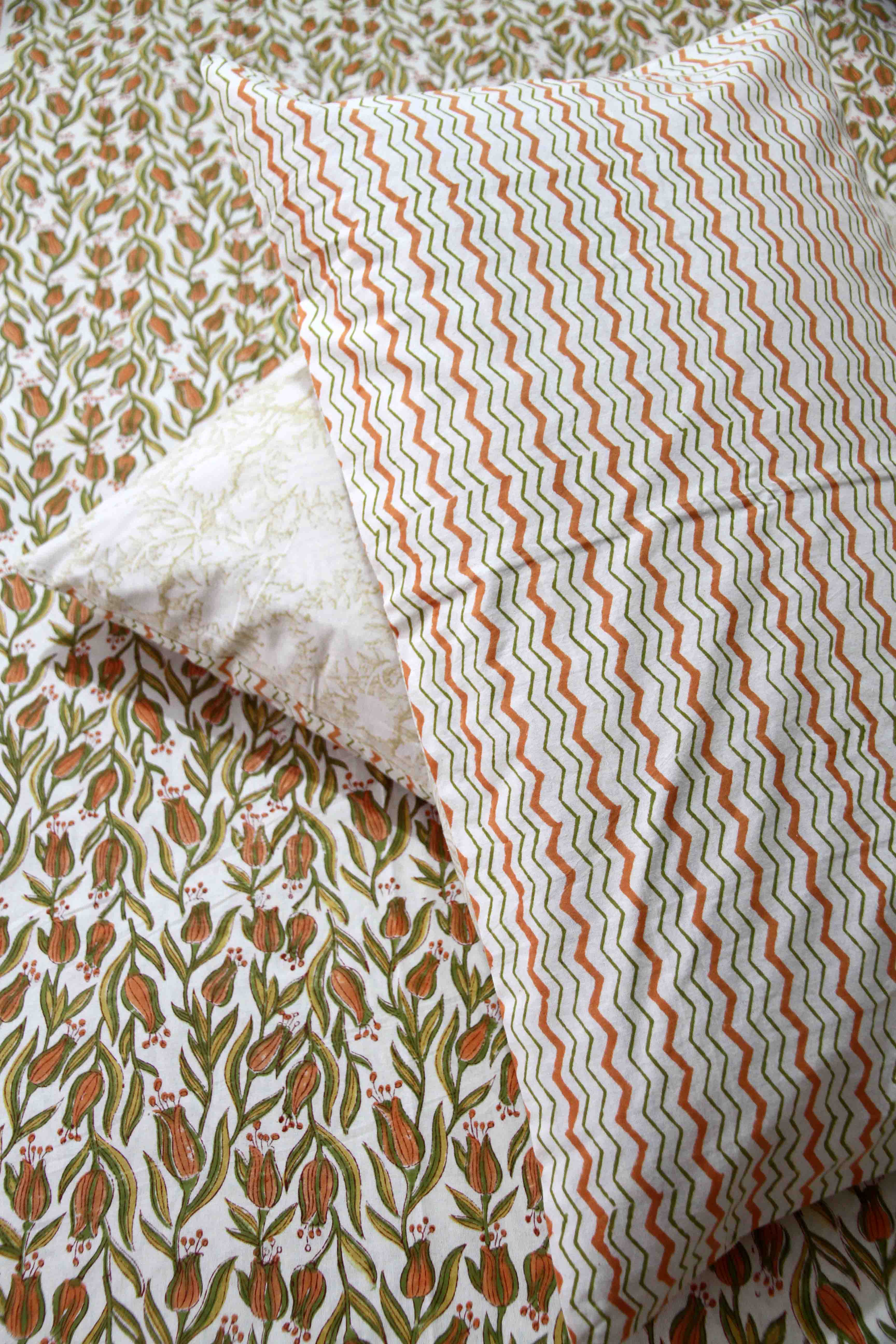 orange and green floral block printed cotton bedsheet with pillow covers