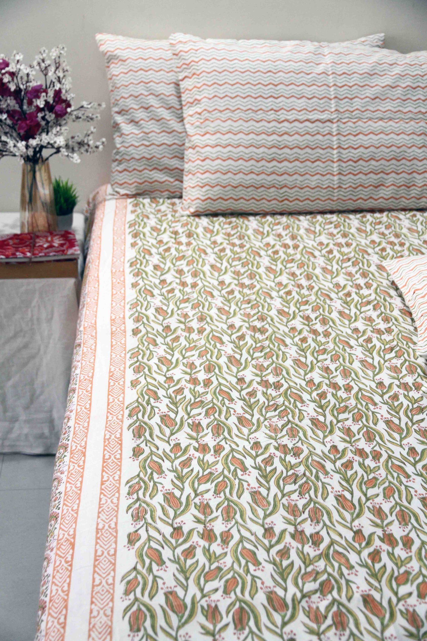 orange and green floral block printed cotton bedsheet with pillow covers
