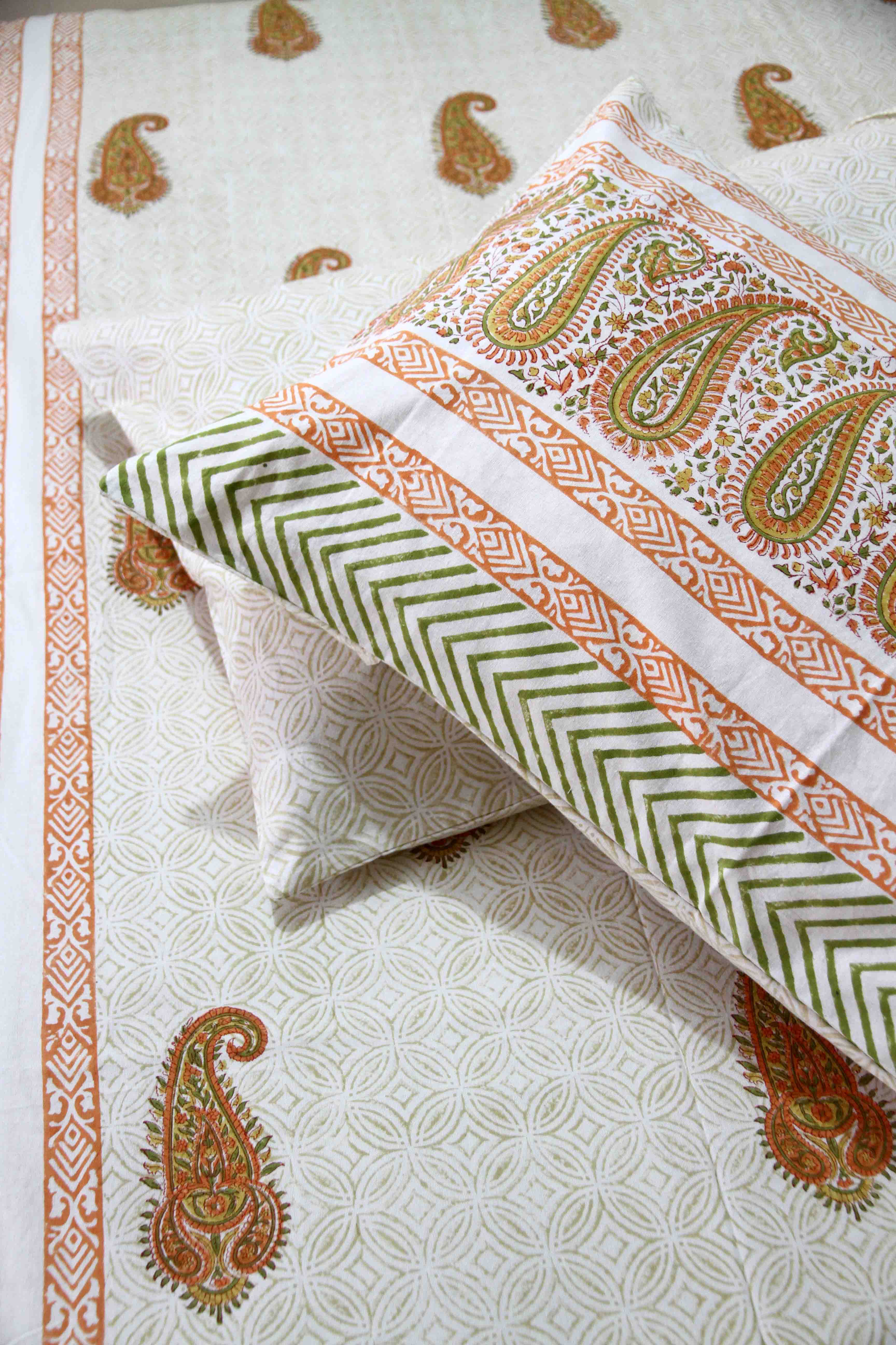 orange and white booti block printed cotton bedsheet with pillow covers