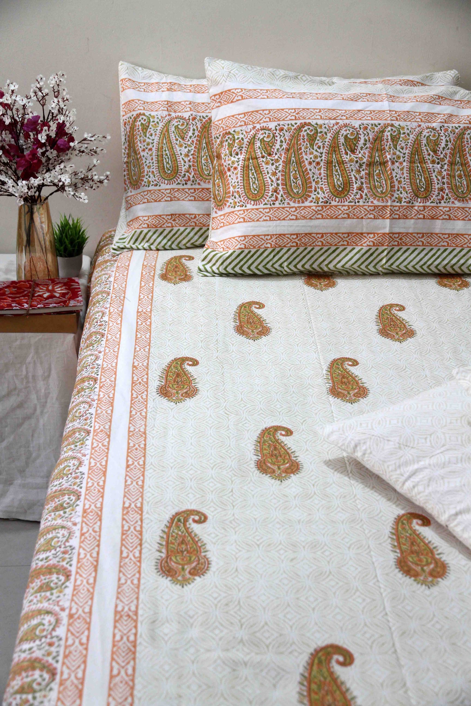 orange and white booti block printed cotton bedsheet with pillow covers