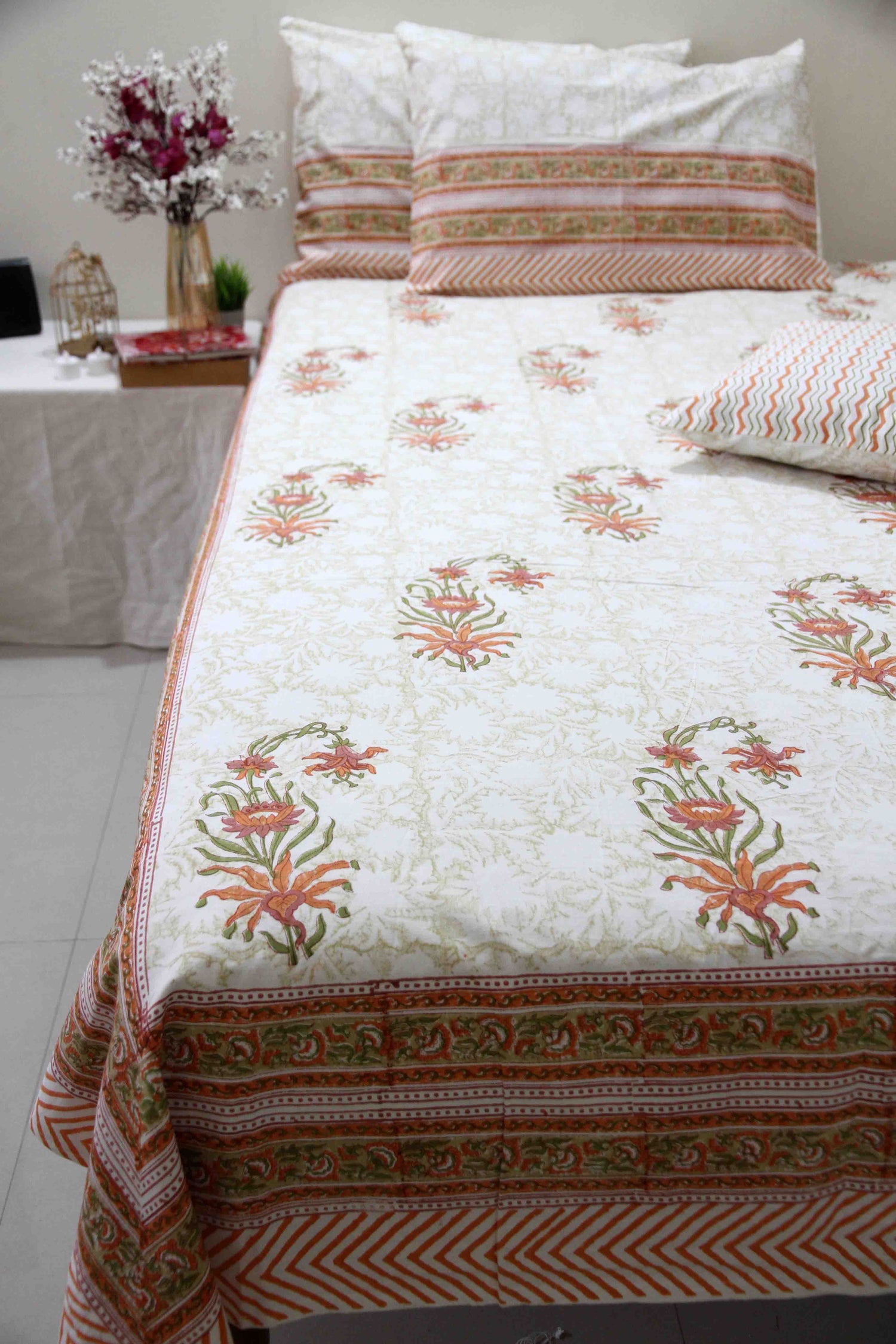 orange and white floral block printed cotton bedsheet with pillow covers