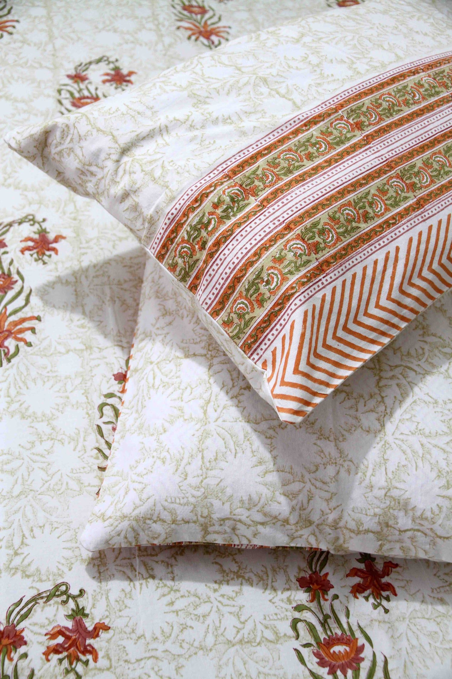 orange and white floral block printed cotton bedsheet with pillow covers